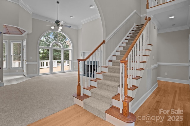 165 Futrell Lndg, New London, NC 28127 - stairway with a ceiling fan, ornamental molding, wood finished floors, a towering ceiling, and recessed lighting