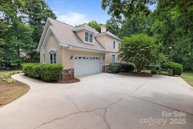 165 Futrell Lndg, New London, NC 28127 - traditional home featuring stucco siding, concrete driveway, stone siding, a chimney, and roof with shingles