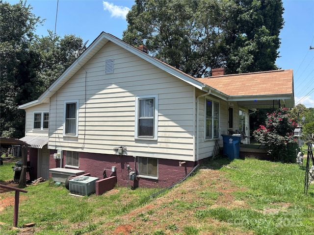 4059 10th Avenue Dr SW, Hickory, NC 28602 - view of home's exterior with a yard, covered porch, and a chimney