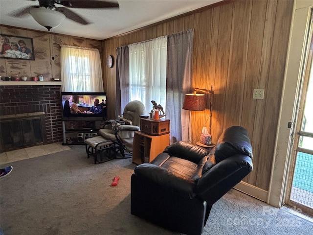 4059 10th Avenue Dr SW, Hickory, NC 28602 - carpeted living room with wooden walls, ceiling fan, and a fireplace