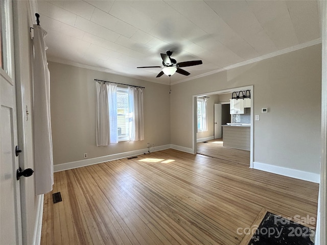 339 Mayflower Ave, Cramerton, NC 28032 - spare room featuring crown molding, light wood-style floors, and a ceiling fan