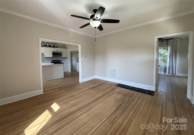339 Mayflower Ave, Cramerton, NC 28032 - empty room with hardwood / wood-style flooring, ceiling fan, and crown molding