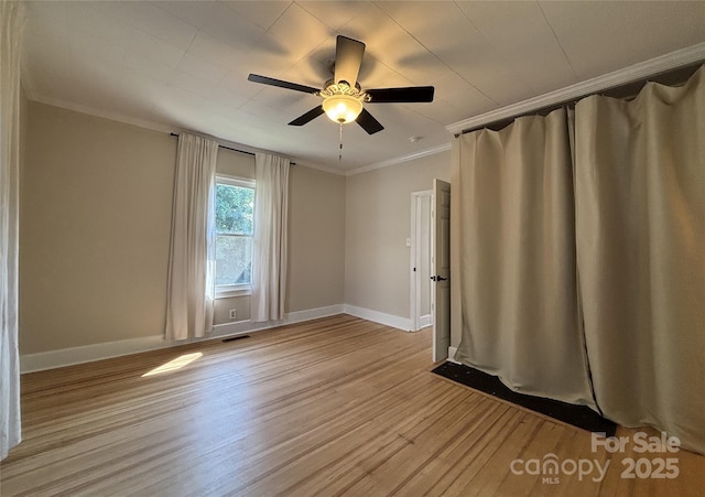 339 Mayflower Ave, Cramerton, NC 28032 - spare room featuring ornamental molding, light wood-style floors, and ceiling fan