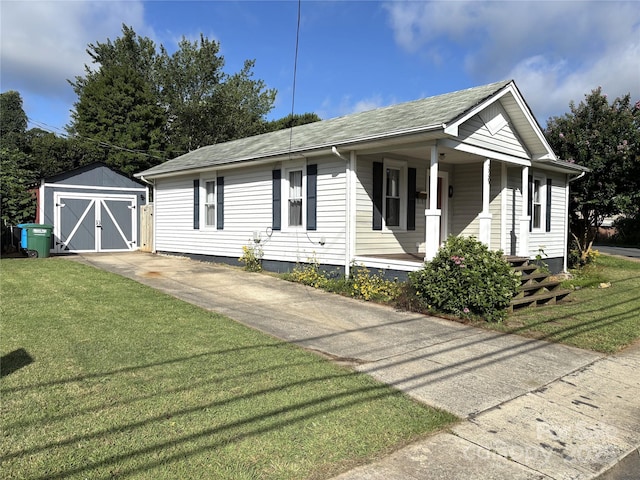 339 Mayflower Ave, Cramerton, NC 28032 - ranch-style house featuring a front yard, covered porch, a shed, and a shingled roof