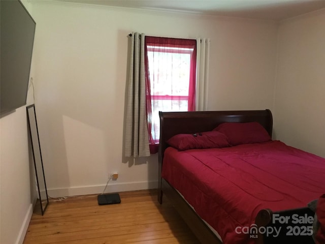 448 Belk St, Lancaster, SC 29720 - bedroom with light wood-type flooring and ornamental molding
