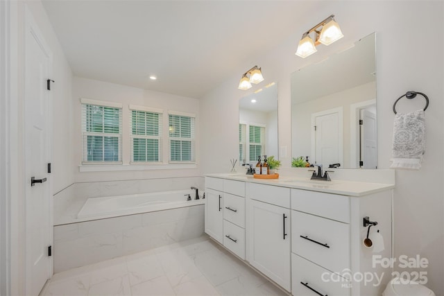 808 Dogwood Creek Ln, Indian Trail, NC 28079 - full bathroom with a garden tub, double vanity, marble look tiles, and recessed lighting