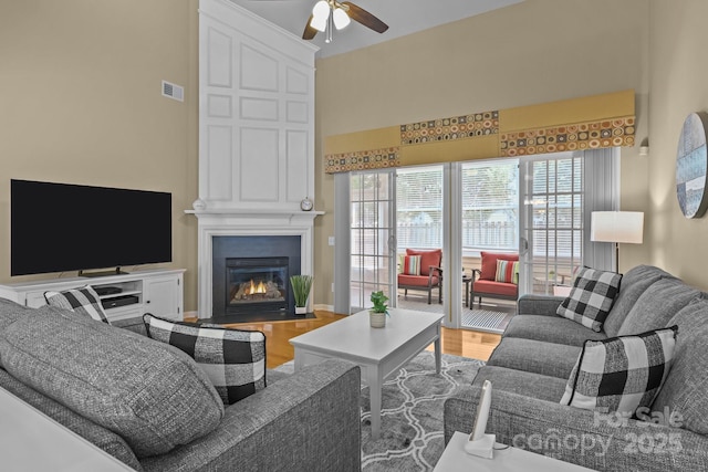 5238 Prosperity View Dr, Charlotte, NC 28269 - living area with ceiling fan, wood finished floors, and a large fireplace