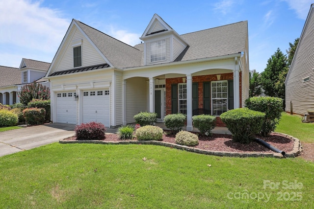 5238 Prosperity View Dr, Charlotte, NC 28269 - view of front facade featuring a front yard, concrete driveway, a porch, and a shingled roof