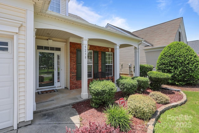 5238 Prosperity View Dr, Charlotte, NC 28269 - property entrance featuring a porch and brick siding