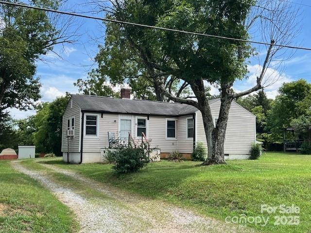 1545 Fairway Acres Dr, Lenoir, NC 28645 - view of front facade with a chimney, a front lawn, and driveway