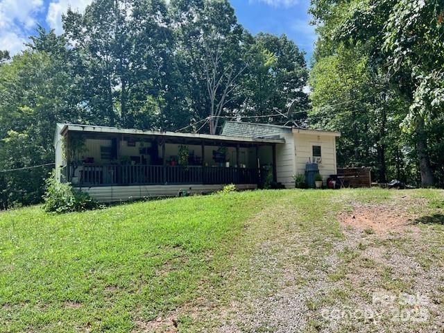 1545 Fairway Acres Dr, Lenoir, NC 28645 - back of house with a yard and a sunroom