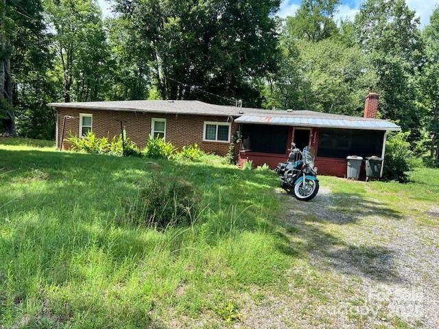 1545 Fairway Acres Dr, Lenoir, NC 28645 - single story home with a chimney and brick siding