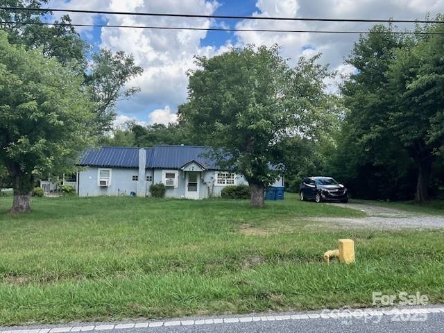 1545 Fairway Acres Dr, Lenoir, NC 28645 - view of front of home with a metal roof and stucco siding