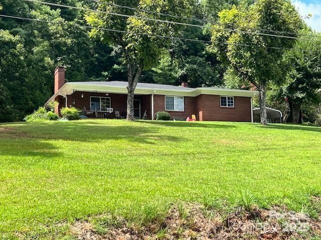 1545 Fairway Acres Dr, Lenoir, NC 28645 - ranch-style home with a chimney, a front lawn, and brick siding