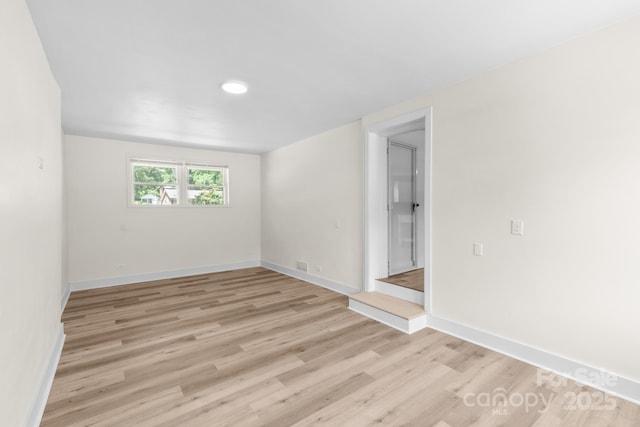 306 2nd Avenue Pl NE, Conover, NC 28613 - unfurnished room with light wood-type flooring and baseboards