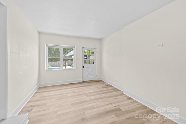 306 2nd Avenue Pl NE, Conover, NC 28613 - empty room featuring light wood-type flooring