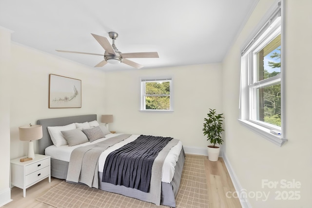 306 2nd Avenue Pl NE, Conover, NC 28613 - bedroom featuring light wood-style flooring and a ceiling fan