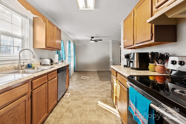 1013 Ashwood Pl, Salisbury, NC 28146 - kitchen with stainless steel appliances, under cabinet range hood, a ceiling fan, and brown cabinetry