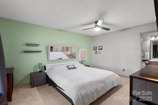 1013 Ashwood Pl, Salisbury, NC 28146 - carpeted bedroom featuring a ceiling fan and a textured ceiling
