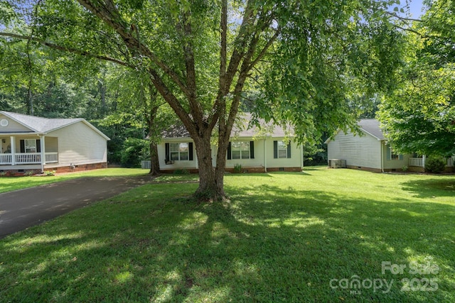 1013 Ashwood Pl, Salisbury, NC 28146 - view of front facade with crawl space, asphalt driveway, a front yard, and covered porch