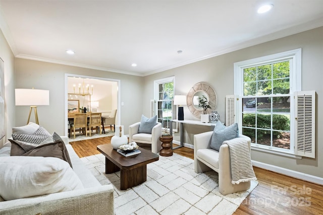 6150 Rocky Falls Rd, Charlotte, NC 28211 - living room featuring plenty of natural light, a chandelier, ornamental molding, light wood-style flooring, and recessed lighting