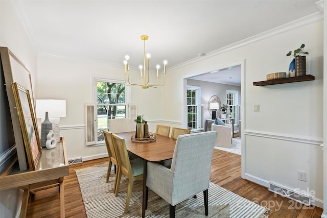 6150 Rocky Falls Rd, Charlotte, NC 28211 - dining room with a chandelier, wood finished floors, and ornamental molding