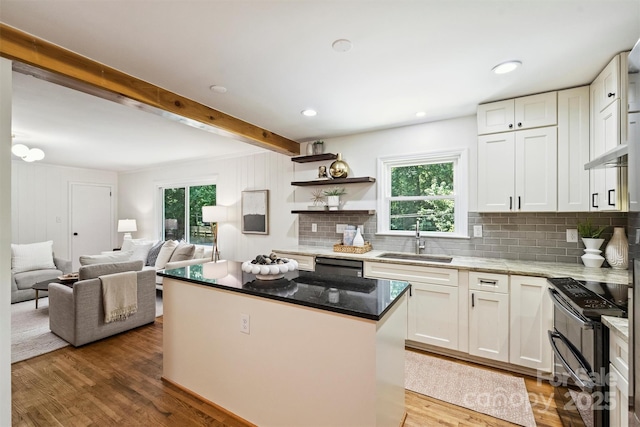 6150 Rocky Falls Rd, Charlotte, NC 28211 - kitchen with double oven range, a kitchen island, plenty of natural light, decorative backsplash, and beam ceiling