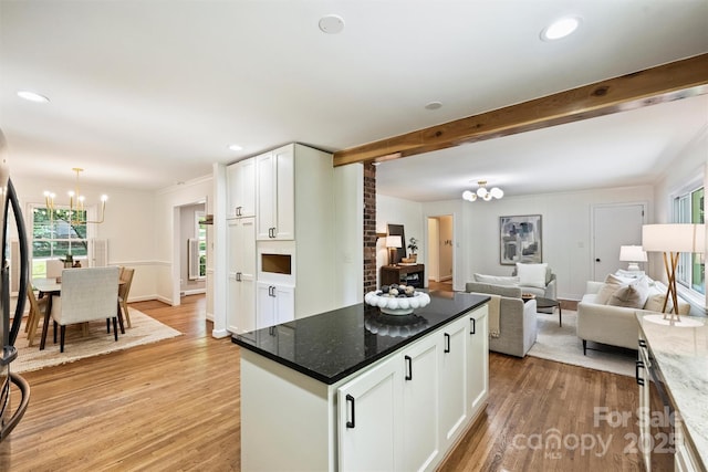 6150 Rocky Falls Rd, Charlotte, NC 28211 - kitchen featuring a chandelier, light wood-type flooring, healthy amount of natural light, white cabinets, and recessed lighting