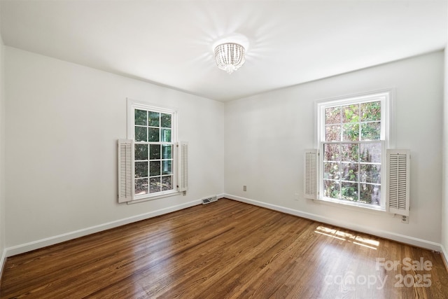 6150 Rocky Falls Rd, Charlotte, NC 28211 - spare room featuring a chandelier and wood finished floors