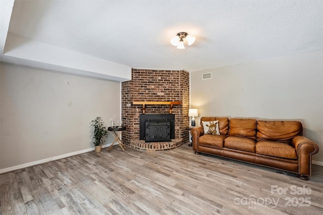 6150 Rocky Falls Rd, Charlotte, NC 28211 - living room with wood finished floors and a fireplace