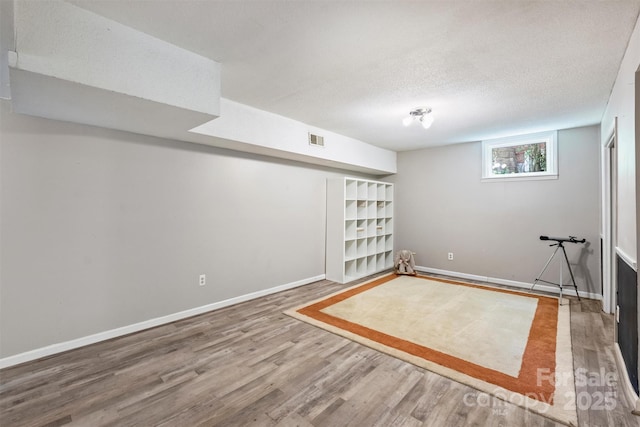 6150 Rocky Falls Rd, Charlotte, NC 28211 - below grade area with wood finished floors and a textured ceiling
