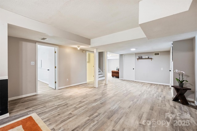 6150 Rocky Falls Rd, Charlotte, NC 28211 - finished basement with light wood-style floors and stairs
