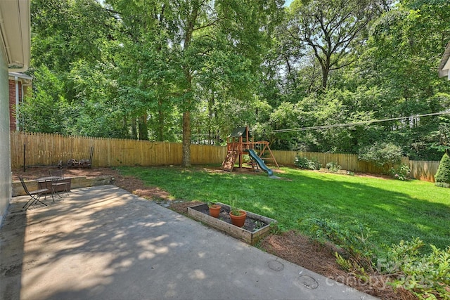 6150 Rocky Falls Rd, Charlotte, NC 28211 - fenced backyard featuring a patio area and a playground