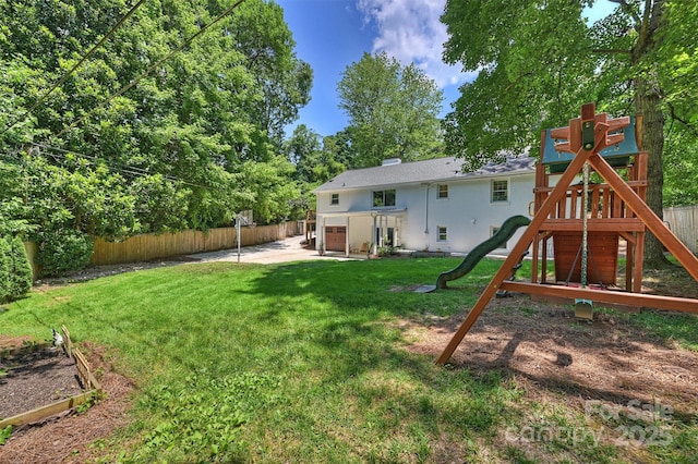 6150 Rocky Falls Rd, Charlotte, NC 28211 - back of house featuring a playground, a fenced backyard, a patio area, and view of wooded area