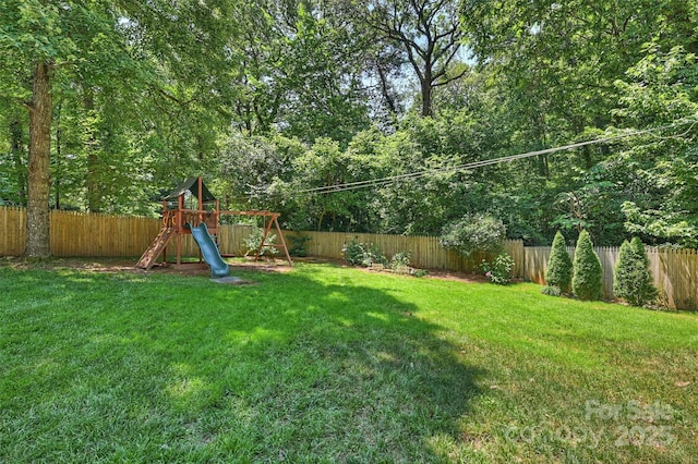 6150 Rocky Falls Rd, Charlotte, NC 28211 - fenced backyard with a playground