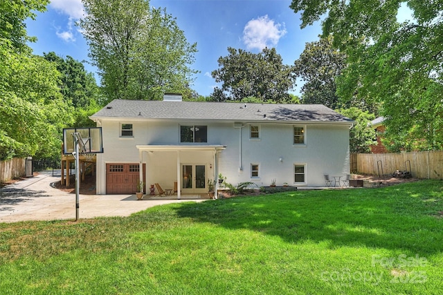 6150 Rocky Falls Rd, Charlotte, NC 28211 - back of property featuring french doors, a garage, driveway, stucco siding, and a patio