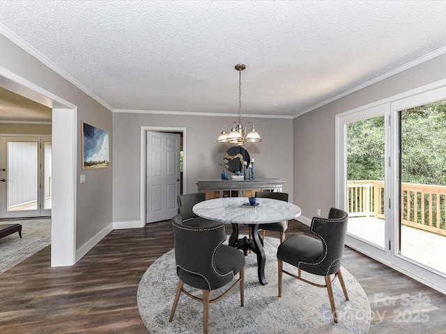 1117 Hidden Brook Ln, Clover, SC 29710 - dining area featuring dark wood-style flooring, a chandelier, a textured ceiling, and ornamental molding