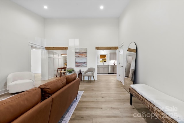 8438 Henry Harris Rd, Fort Mill, SC 29707 - living room featuring a high ceiling, light wood-style flooring, and recessed lighting