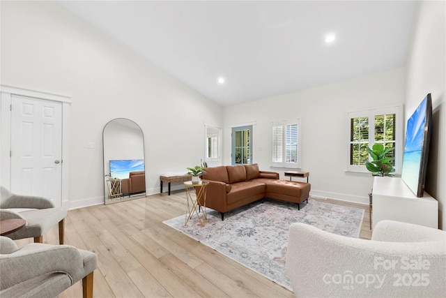 8438 Henry Harris Rd, Fort Mill, SC 29707 - living area featuring high vaulted ceiling, light wood-type flooring, and recessed lighting