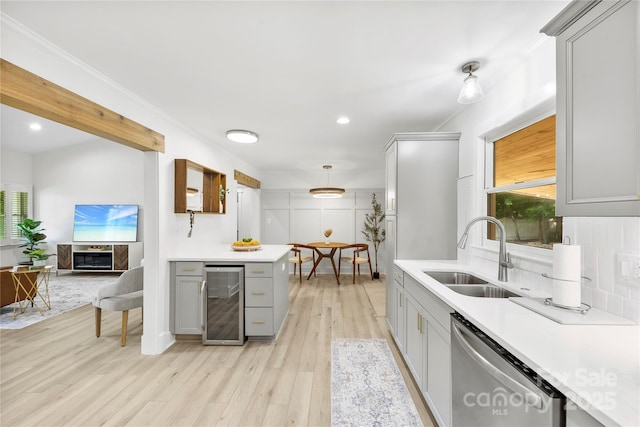 8438 Henry Harris Rd, Fort Mill, SC 29707 - kitchen featuring wine cooler, dishwasher, gray cabinets, light countertops, and plenty of natural light