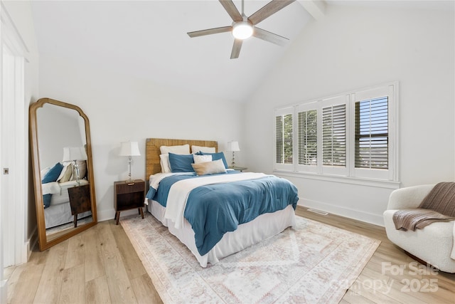 8438 Henry Harris Rd, Fort Mill, SC 29707 - bedroom featuring high vaulted ceiling, beamed ceiling, light wood-style floors, and ceiling fan