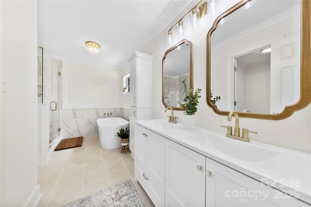 8438 Henry Harris Rd, Fort Mill, SC 29707 - full bath with double vanity, a shower stall, a soaking tub, tile patterned flooring, and ornamental molding