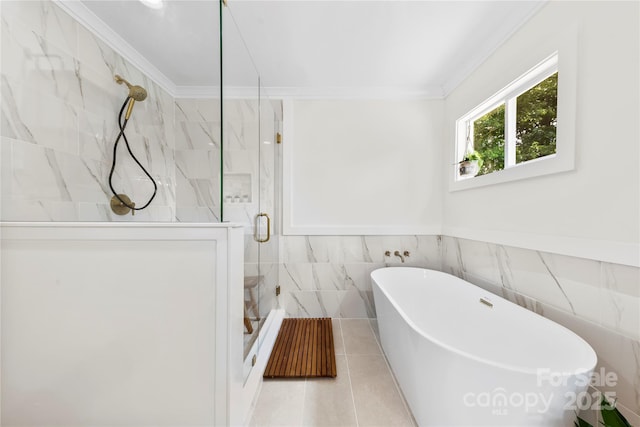 8438 Henry Harris Rd, Fort Mill, SC 29707 - full bathroom featuring crown molding, a stall shower, tile walls, a soaking tub, and tile patterned floors