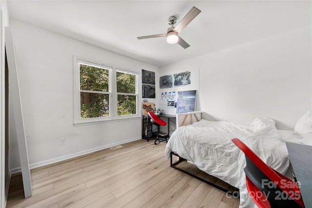 8438 Henry Harris Rd, Fort Mill, SC 29707 - bedroom with wood finished floors, an office area, and ceiling fan