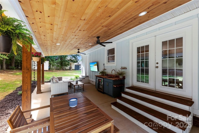 8438 Henry Harris Rd, Fort Mill, SC 29707 - view of patio featuring french doors, entry steps, ceiling fan, beverage cooler, and an outdoor living space