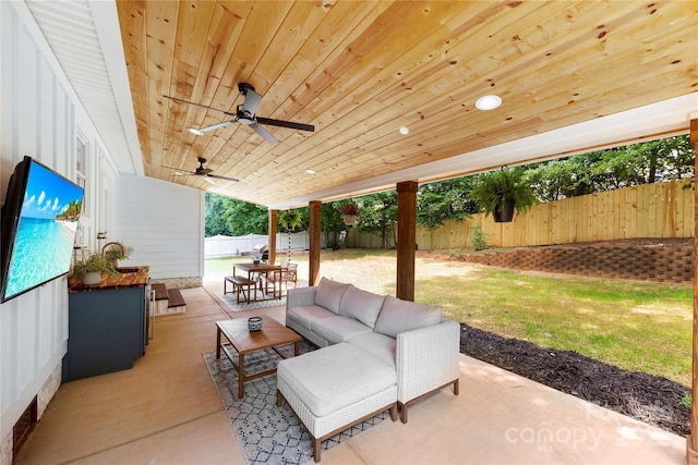 8438 Henry Harris Rd, Fort Mill, SC 29707 - fenced backyard with an outdoor living space, a patio area, outdoor dining area, and a ceiling fan