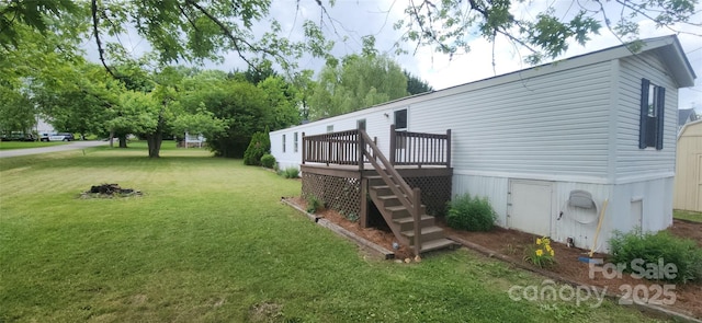 67 Brown Lynch Rd, Candler, NC 28715 - view of grassy yard featuring stairway and a wooden deck
