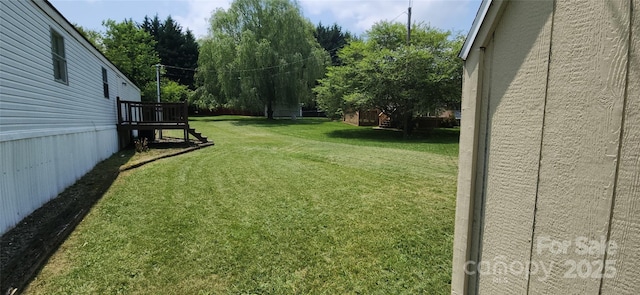 67 Brown Lynch Rd, Candler, NC 28715 - view of green lawn with a wooden deck