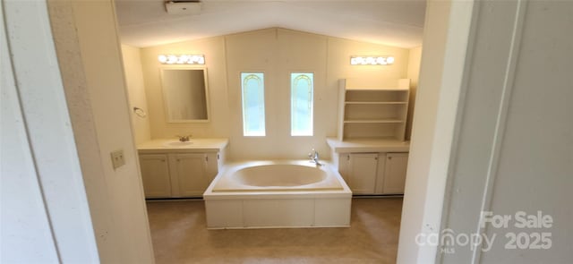 67 Brown Lynch Rd, Candler, NC 28715 - bathroom with a garden tub, vanity, and vaulted ceiling