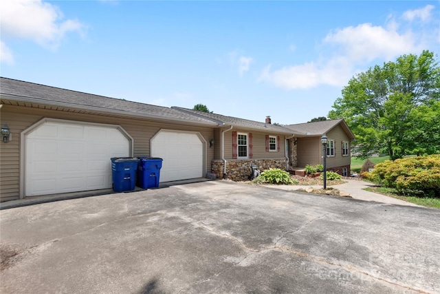 5563 Grace Chapel Rd, Hickory, NC 28601 - single story home with a garage, asphalt driveway, a chimney, and a shingled roof